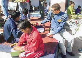 One of the members of the Rotary District 6110 Arkansas, USA, team interacts with special children at Saket Hospital, Panchkula, on Wednesday.