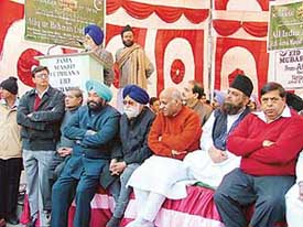 The Lok Sabha Deputy Speaker, Mr Charanjit Singh Atwal, addresses the Eid congregation at Jama Masjid, Ludhiana, on Wednesday. The Mayor, Mr Nahar Singh Gill, the District Congress Committee President, Mr Jagmohan Sharma, Mr Atiq-u-Rehman and the Parliamentary Secretary, Mr Surinder Dawer, are also seen in the picture. 