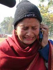 Mrs Sarbjit Kaur sobs as she talks on the phone to her husband Kuldip Singh trapped in Kuwait