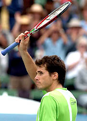 Tommy Haas of Germany waves to the crowd after defeating Roger Federer of Switzerland at the Kooyong Classic in Melbourne on Wednesday