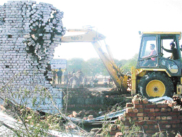 PUDA demolishes unauthorised structures at Sector 77 in Mohali on Thursday.