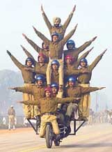 BSF personnel form a pyramid on a motor cycle during practice for the Republic Day parade in New Delhi on Thursday. 