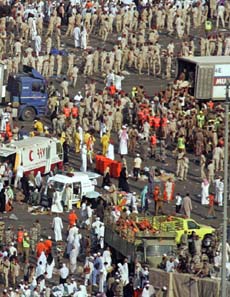 Bodies of pilgrims are removed in Mena outside Mecca on Thursday. At least 345persons were killed in crowding during the stoning ritual at the Haj pilgrimage