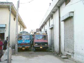 The controversal godowns and trucks in the residential area of Guru Arjan Dev Nagar