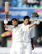 Younis Khan celebrates his century during the first day of the first Test at the Gaddafi Cricket Stadium in Lahore on Friday