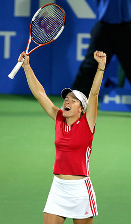 Justine Henin-Hardenne of Belgium celebrates after defeating Francesca Schiavone of Italy during the womens singles final at the Sydney International Tennis Tournament on Friday