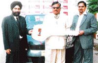 Winner Madal Lal Goyal being presented the key to the Maruti Swift car