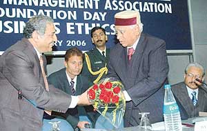 Mr B.M. Gulati, president of the Chandigarh Management Association, welcomes the chief guest, Dr A.R. Kidwai, at the foundation day function of the association in Chandigarh on Saturday.