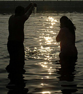 A couple offering prayers on the banks of the Yamuna on Makar Sanskrati in the Capital on Saturday.