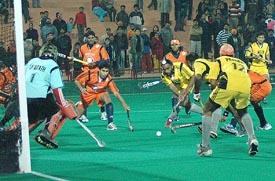Sher-e-Jallandhar (in yellow) in action against Bangalore Lions in a PHL Tier I match in Chandigarh on Saturday. Lions won 2-0. 