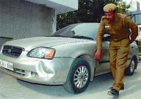 A police jawan showing the accidental car at Paschim Vihar in the Capital