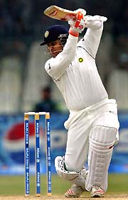 Virender Sehwag plays a shot on the third day of the first Test between India and Pakistan in Lahore on Sunday