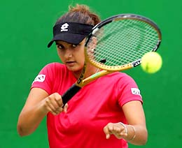 Sania Mirza hits a forehand during a training session in Melbourne on Sunday. Sania will take on qualifier Victoria Azarenka of Belarus in the first round of the Australian Open on Tuesday
