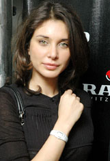 Bollywood actress and Rado brand ambassador Lisa Ray poses with the newly launched Rados Sintra watch in New Delhi on Tuesday.