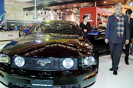 Haryana CM Bhupinder Singh Hooda visits a stall at Auto Expo in New Delhi on Tuesday