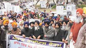 Members of the Punjab Rights Forum stage a demonstration in front of the DC office in Ludhiana on Tuesday