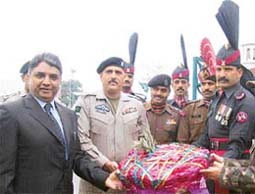 Mr V.K. Duggal presents sweets to Pakistan Rangers at the Wagah checkpost on Tuesday.