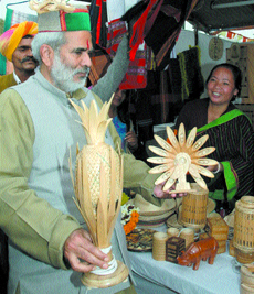 Union Minister of Rural Development Ranghuvansh Prasad Singh visiting a stall after the inauguration of SARAS 2006 at Dilli Haat in the Capital on Wednesday.