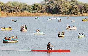 After a foggy night, sky brightens up in the afternoon. Taking full advantage of a fine weather, people go boating on the Sukhna Lake in Chandigarh on Thursday. 