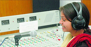 An FM Rainbow radio jockey in Jalandhar chats with a caller. Tribune photo: Pawan Sharma