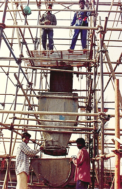Workers often remove their helmets and hang them aside.