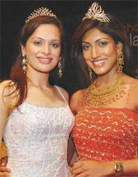 SPARKLE ALL THE WAY: Amrita Thapar-Miss India Universe 2005(left)Sindhura Gadde, Miss India World, 2005(right) flashing their tiaras as well as pearly whites.
