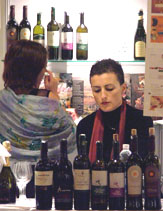 Foreign tourists take a closer look at different types of wines at the 4th India International Food and Wine Show, 2006, in New Delhi on Friday.