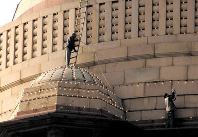 Workers fixing lights to illuminate Rashtrapati Bhavan on the occasion of the forthcoming Republic Day in the Capital on Friday