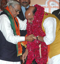 Newly elected BJP President Rajnath Singh is blessed by Mr Atal Bihari Vajpayee at the BJP National Council meeting in New Delhi