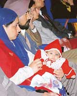 Three-month-old Sahibjeet with his parents at a function held to launch the Minno Sambhi Free Blood Service for Thalassaemic Children at the Rotary and Blood Bank Society Resource Centre, Sector 37, in Chandigarh