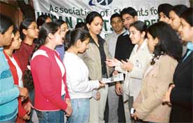 Students of GGDSD College, Sector 32, Chandigarh, sign up with the Association of Students for Human Rights Awareness on the college campus on Thursday