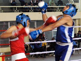 A boxing bout in progress during the National School Games in Ludhiana on Saturday