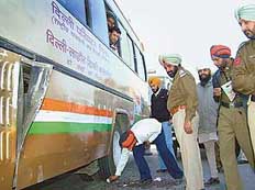 Punjab police personnel inspect the Delhi- Lahore-Delhi bus, which met with an accident on National Highway-1 in Jalandhar on Saturday.