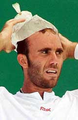 Perus Luis Horna cools himself with ice during a break between games during an Australian Open third round match against Frances Paul-Henri Mathieu in Melbourne on Saturday