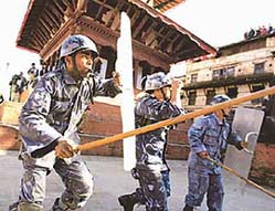Nepali policemen dodge stones pelted by pro-democracy demonstrators at Basantpur Durbar Square