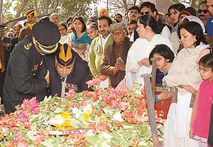 Lt-Col Rajeev Bakshis father, Lt-Col J.M.L. Bakshi (retd), pays tributes to his fallen son as his wife Nandita (right) along with their daughters Arzoo and Amanat look on in Panchkula on Sunday.