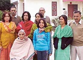 Family members of martyr Lt-Col Kaman Singh Pathania in a cheerful mood after receiving a letter from the Army authorities for the renaming of Aman Setu as Kaman Aman Setu at Kandrori-Surajpur village in Kangra district of Himachal Pradesh on Thursday.