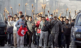 Pro-democracy protesters hold a torch rally in Kathmandu