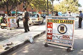 Advertisements being displayed on barricades at the Sector 17 parking lot entrance in violation of municipal corporation rules