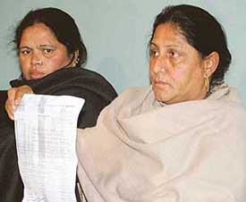 Sarpanch Kamlesh with an FIR copy at Chandigarh Press Club on Monday