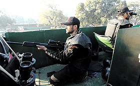 A Black Cat commando keeping vigil during the rehearsal for the Republic Day Parade in the Capital on Monday