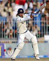 Mahendra Dhoni plays a shot during the third day of the second Test in Faisalabad on Monday