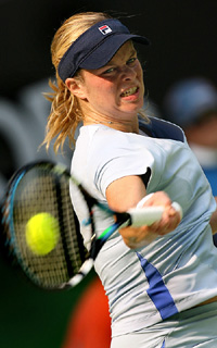 Belgiums Kim Clijsters in action against Italys Francesca Schiavone at the Australian Open in Melbourne on Monday