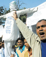 Activists of Rahul-Priyanka brigade demonstrating against Samajwadi Party leader Amar Singh's comments against Congress president Sonia Gandhi in the phone tapping case at Jantar Mantar in the Capital on Tuesday