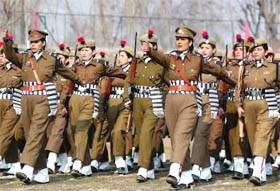 A contingent of police women parade during full dress rehearsal for the Republic Day celebrations at Bakshi Stadium in Srinagar on Tuesday