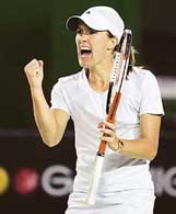 Justine Henin-Hardenne of Belgium reacts during her match against Lindsay Davenport of the US at the Australian Open in Melbourne on Tuesday. 