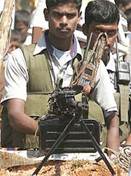 A Tamil Tiger rebel guards the A9 Highway in Vavuniya