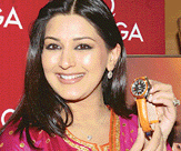 Omega brand ambassador Sonali Bendre poses with a watch at the inauguration of a company showroom in New Delhi on Friday evening.