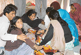 Relatives of Hari Pal are inconsolable following his murder in Ambala on Saturday.