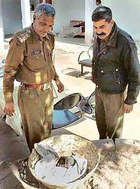Policemen with the body of a half-eaten infant found in Sector 12, Panchkula, on Monday